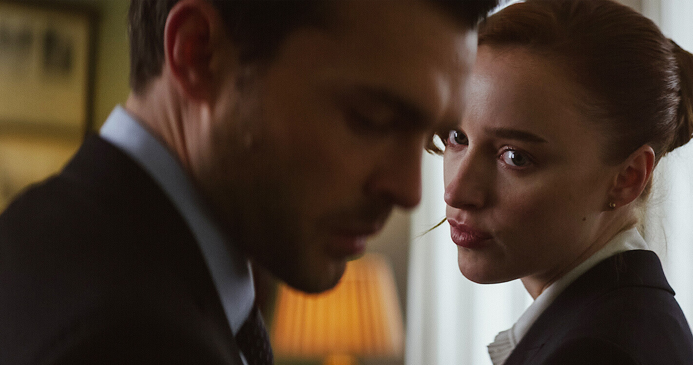 Alden Ehrenreich and Phoebe Dynevor looking conflicted.