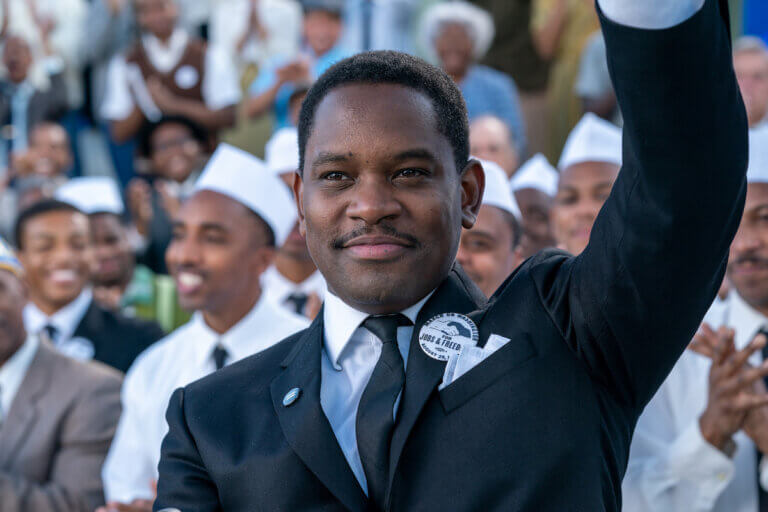 Aml Ameen in a suit portraying Dr. Martin Luther King Jr. 