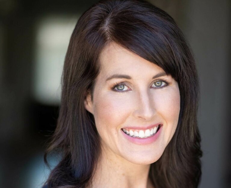 Phoenix, Arizona local actor Leslie Infalt smiling and wearing a blue shirt.