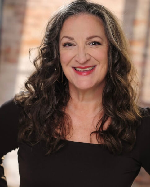 Actor Jesica Paige smiling in a black shirt.