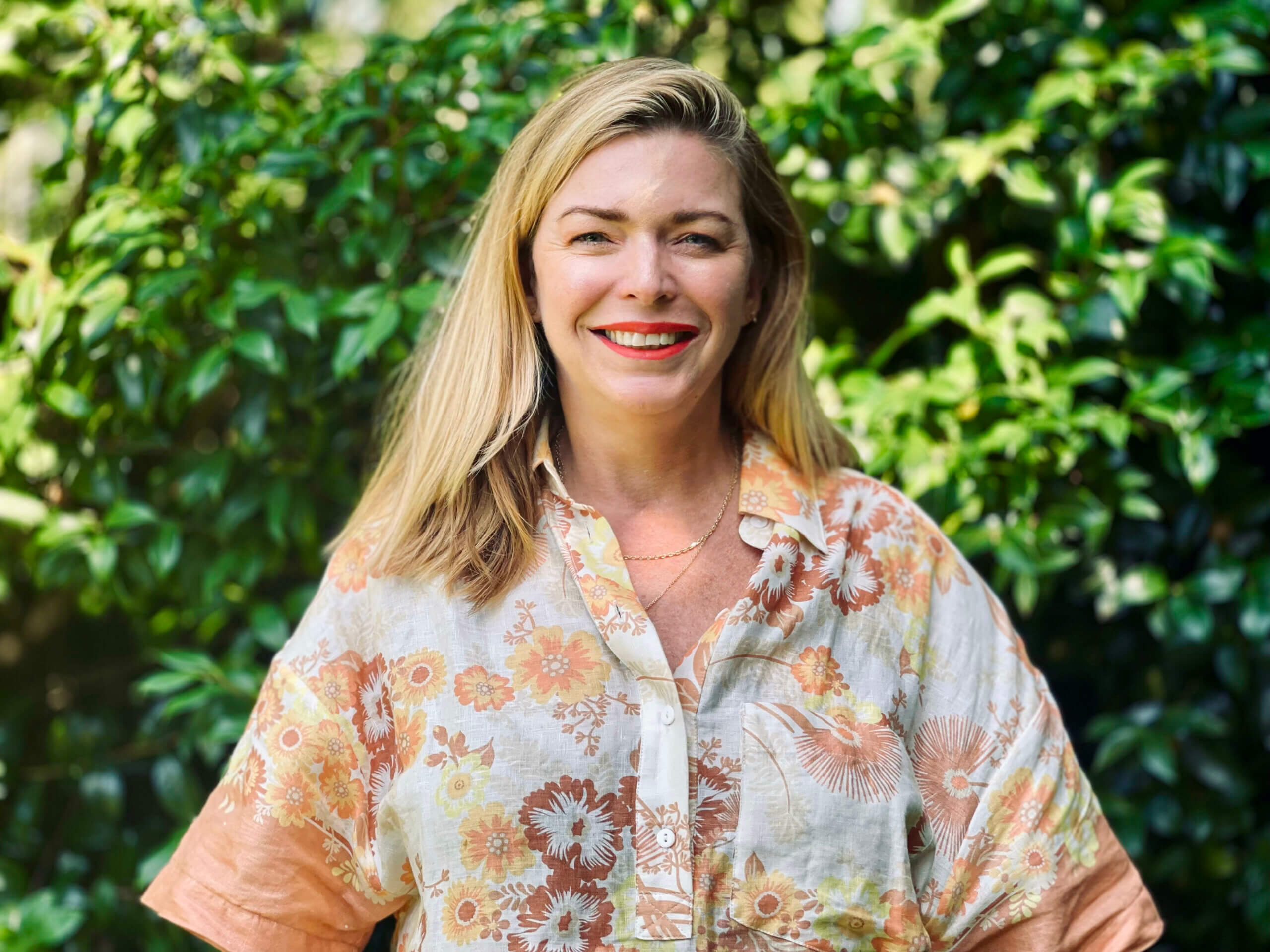 casting directo Natalie Jane Harvie in a floral shirt outside.