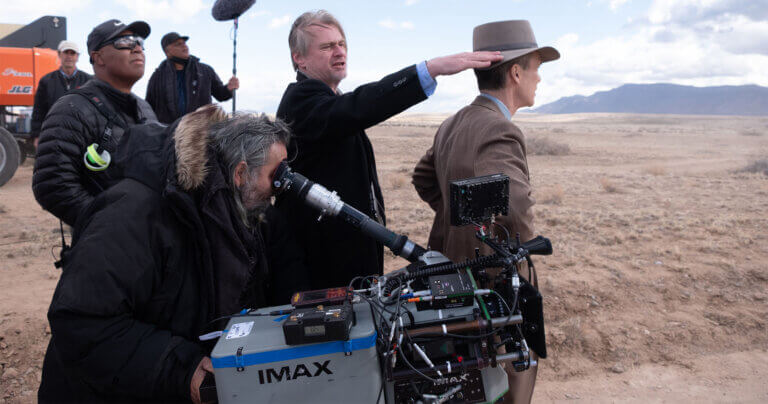 Director Christopher Nolan and crew filming Oppenheimer outside.