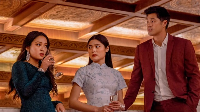 Chelsea Zhang, Ashley Liao, and Ross Butler talking inside.