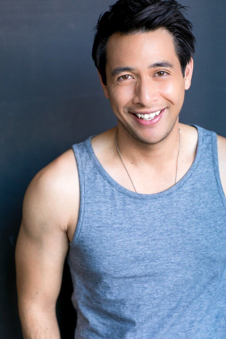 Actor Ron Nery Jr. in a blue tanktop.