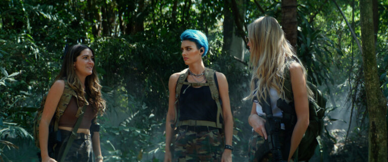 (L-R) Isabelle Fuhrman,  Wallis Day and Sasha Luss in the jungle wearing camouflage.