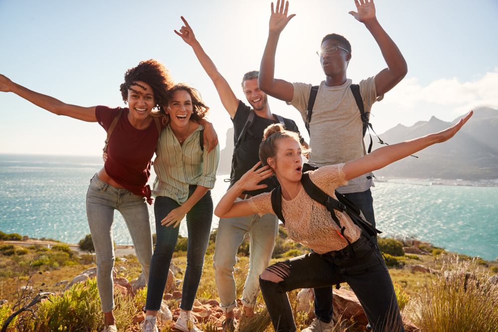 Friends outside on a hike posing.