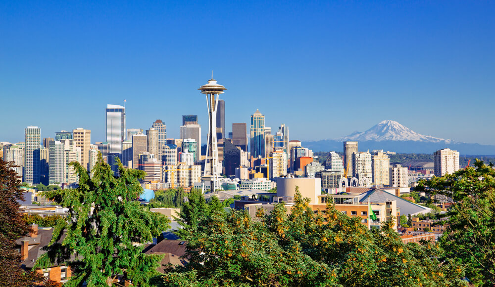 Seattle, Washington skyline during the day with Mt. Rainier in the background.