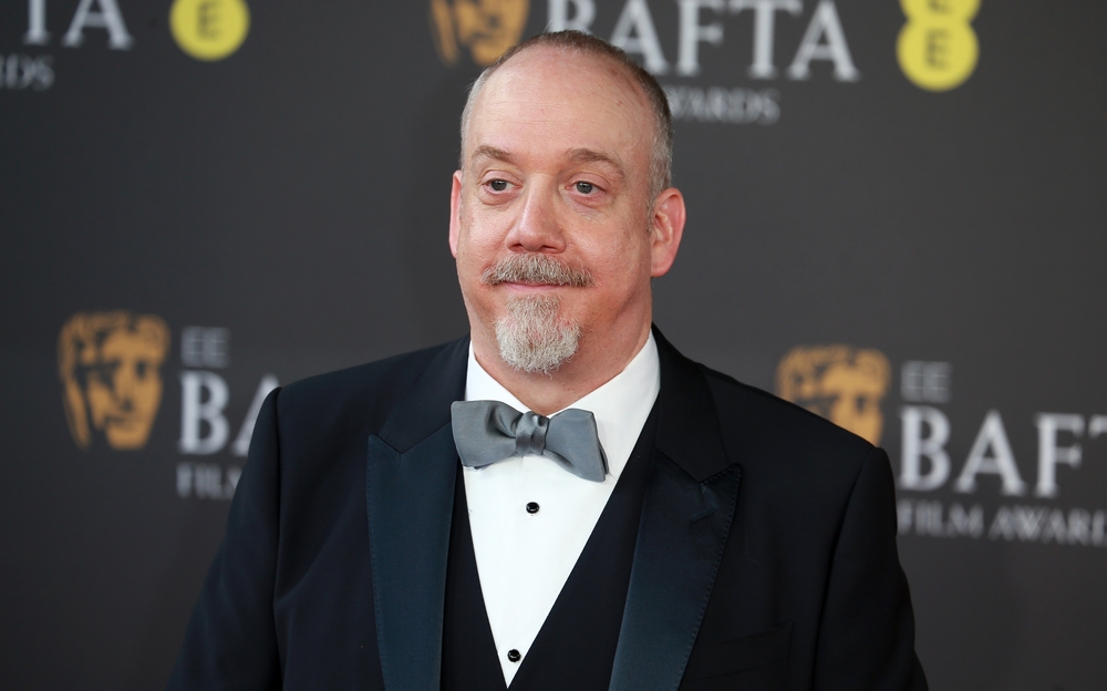 Paul Giamatti in a tuxedo smiling.